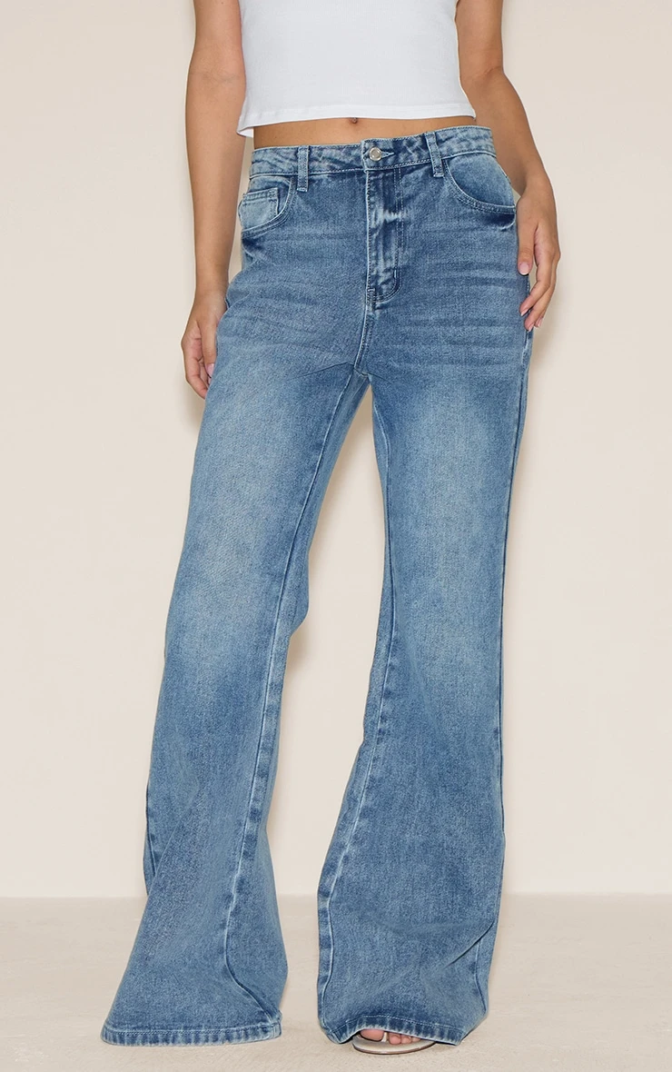 Prettylittlething Mid Blue Wash High Waist Extreme Flared Leg Jeans 1 Prettylittlething Mid Blue Wash High Waist Extreme Flared Leg Jeans