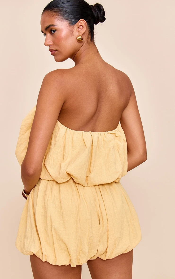 Prettylittlething Lemon Puffball Detail Bandeau Romper 2 Prettylittlething Lemon Puffball Detail Bandeau Romper - Image 2