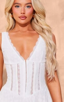 Prettylittlething White Textured Lace Corset Detail Floaty Romper -Pretty Little Thing Shop 1a4cedf0fb2b513ced134c7df4feded7237f4c72 cnj7057 4