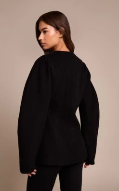 Prettylittlething Black Wool Look Collarless Cocoon Sleeve Blazer 5 Prettylittlething Black Wool Look Collarless Cocoon Sleeve Blazer -Pretty Little Thing Shop 1d5c479bf77c37670fb47e73550db8bece6c491a CNN8541 2 black wool look collarless cocoon sleeve blazer