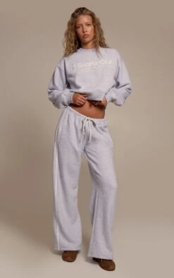 Prettylittlething Ash Grey Sports Club Print Wide Leg Sweatpants -Pretty Little Thing Shop 28de6aac43685502df0348695773a704d45a4e41 CNO4666 2 ash grey sports club print wide leg joggers