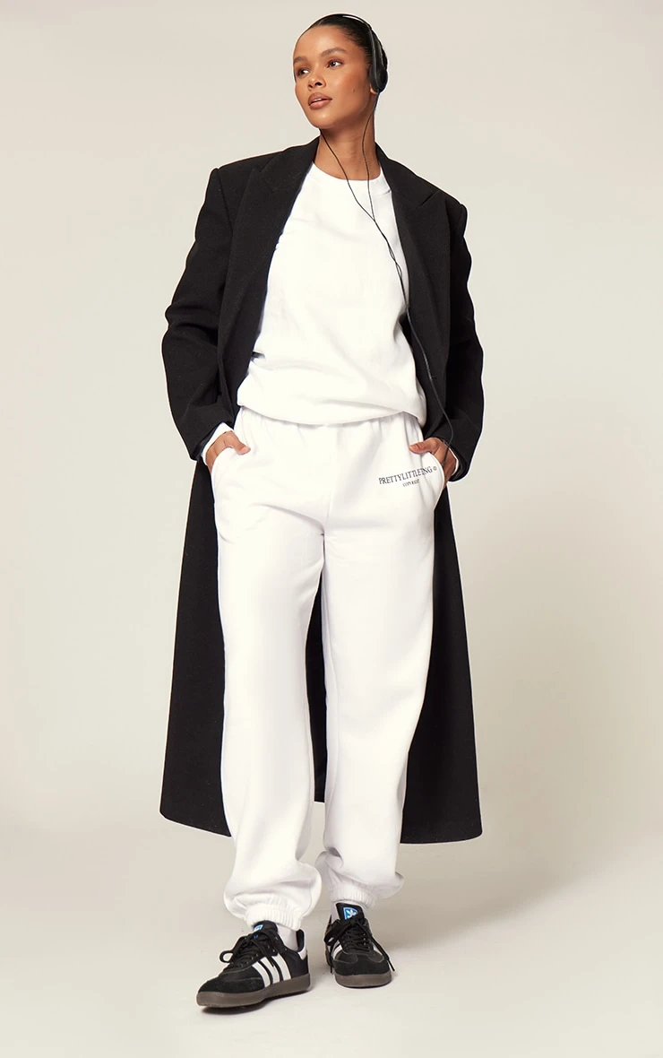 PRETTYLITTLETHING White Graphic Copyright Sweatpants 1 PRETTYLITTLETHING White Graphic Copyright Sweatpants