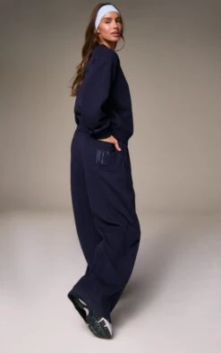 Prettylittlething Navy Embroidered Interlock Wide Leg Sweatpant 7 Prettylittlething Navy Embroidered Interlock Wide Leg Sweatpant -Pretty Little Thing Shop 44f9fe0bbe13a336e81d0f963c1bf6ccd14ab392 CNN3189 3 navy embroidered interlock wide leg jogger