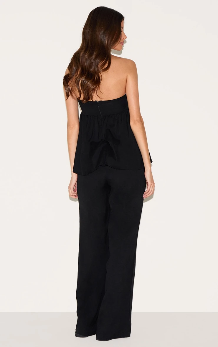 Prettylittlething Black Bandeau Peplum Detail Jumpsuit 2 Prettylittlething Black Bandeau Peplum Detail Jumpsuit - Image 2