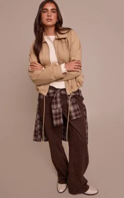 Prettylittlething Beige Utility Style Draw Cord Bomber Jacket -Pretty Little Thing Shop 562926c5bb7ec5b7a720771f221f463bf87bca4b CNN8446 3 beige utility style draw cord bomber jacket