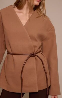 Prettylittlething Camel Collarless Wrap Style Tie Waist Wool Look Coat 8 Prettylittlething Camel Collarless Wrap Style Tie Waist Wool Look Coat -Pretty Little Thing Shop 638c4c1c383fa182f31c33955aa376261f7a22ff CNN8525 4 camel collarless wrap style tie waist wool look coat