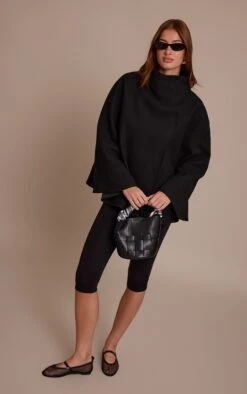 Prettylittlething Black Wool Look Funnel Neck Wrap Coat -Pretty Little Thing Shop 8712ab01d7523ce384a6eb9fe936fd4a4e4f9c5d CNN8533 3 black wool look funnel neck wrap coat