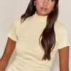 Buttercream Soft Rib High Neck Fitted Longline T-Shirt 9 Buttercream Soft Rib High Neck Fitted Longline T-Shirt -Pretty Little Thing Shop 88bc0cff6b3be1d71f43da1491d904a3074f8014 CNO2451 1 buttercream soft rib high neck fitted longline t shirt