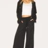 Prettylittlething Black Peach Skin Woven Wide Leg Pants -Pretty Little Thing Shop 8a047a91811e6bd5a16854c2eff693c850e3293c CNM0139 1 black peach skin woven wide leg trousers