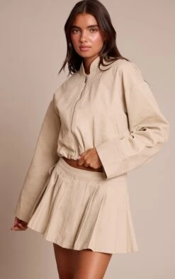 Prettylittlething Sand Pleated Denim Mini Skirt -Pretty Little Thing Shop 8a4cc4f6e826c06ad5fb4bbe46b5def834b8444f CNN6872 4 sand pleated denim mini skirt