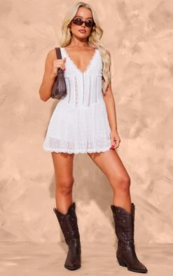 Prettylittlething White Textured Lace Corset Detail Floaty Romper -Pretty Little Thing Shop c4f686ffeefaa66037bc78e9773629dda181d913 cnj7057 3