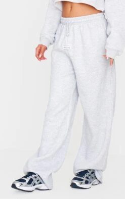 PRETTYLITTLETHING Ash Grey Badge Detail Mid Rise Wide Leg Sweatpants 6 PRETTYLITTLETHING Ash Grey Badge Detail Mid Rise Wide Leg Sweatpants -Pretty Little Thing Shop c56222a2b4475ae5cfaa8b53a729f52d1f763ba1 CNJ5145 2 prettylittlething ash grey badge detail mid rise wide leg joggers