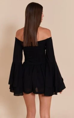 Prettylittlething Black Bardot Flare Sleeve Romper -Pretty Little Thing Shop cc4ea9542e3fad5595fe931b691a3bb278e015c2 CNN4946 2 black bardot flare sleeve playsuit