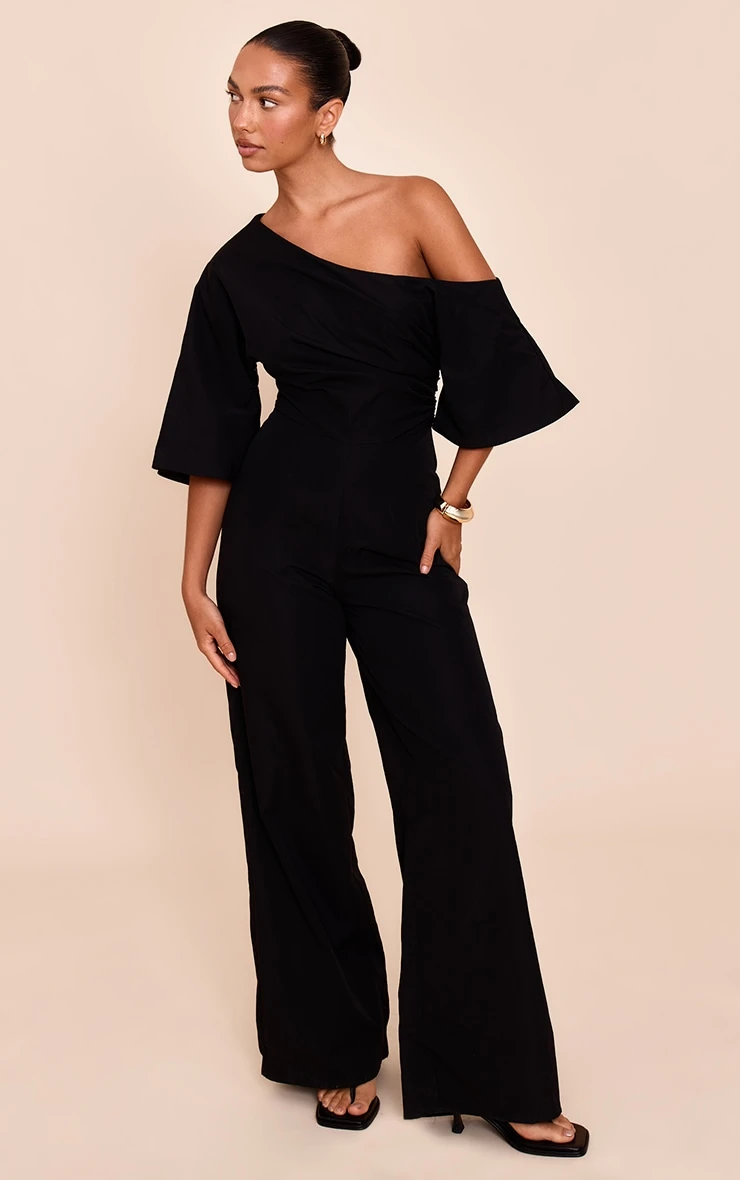Prettylittlething Black Woven Asymmetric Short Sleeve Wide Leg Jumpsuit