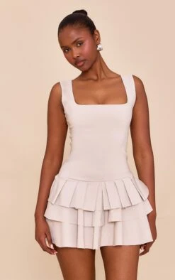 Prettylittlething Light Taupe Stretch Woven Pleated Skort Romper -Pretty Little Thing Shop d3e035dabc7b596de1629baec9d8f99ddf5f39b8 CNN1344 4 butter yellow stretch woven pleated skort playsuit