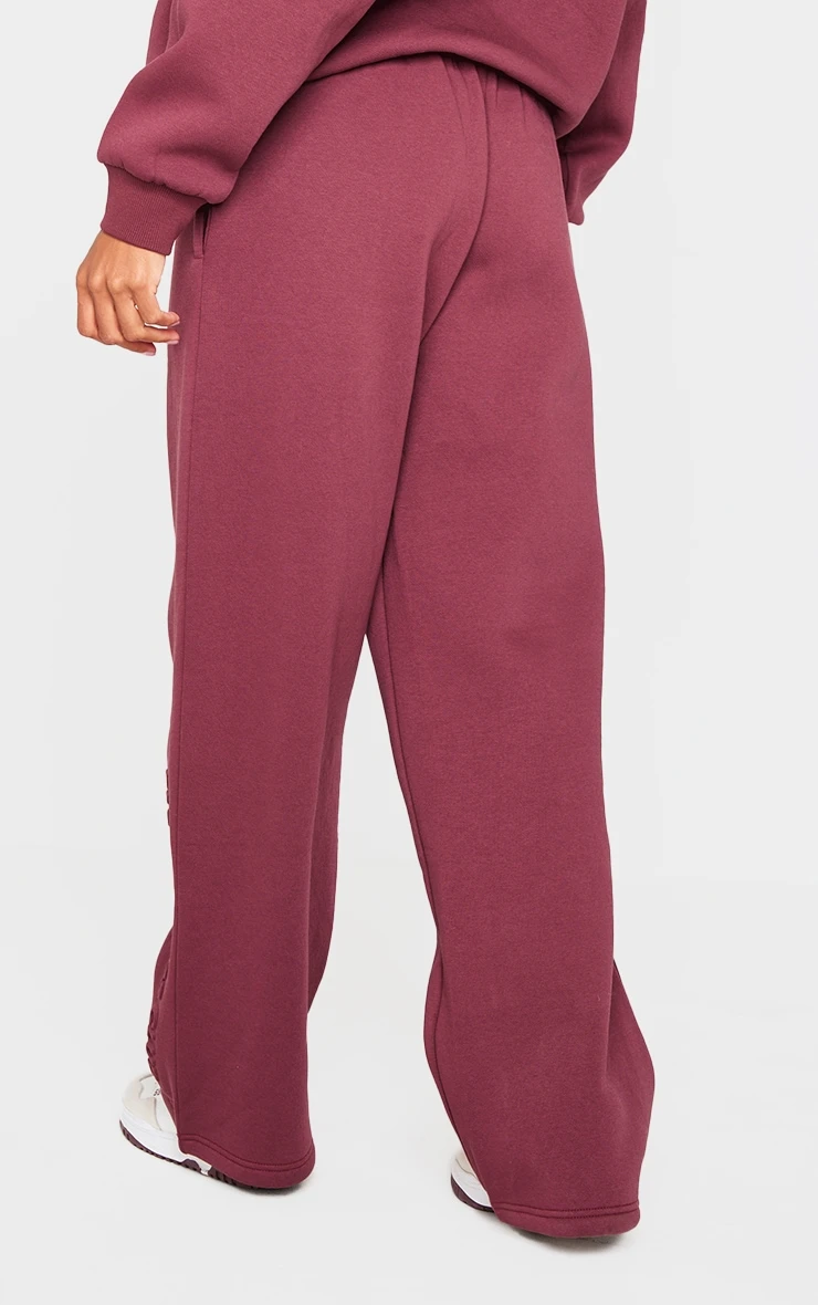 PRETTYLITTLETHING Burgundy Athletics Club Embossed Straight Leg Sweatpants 3 PRETTYLITTLETHING Burgundy Athletics Club Embossed Straight Leg Sweatpants - Image 3