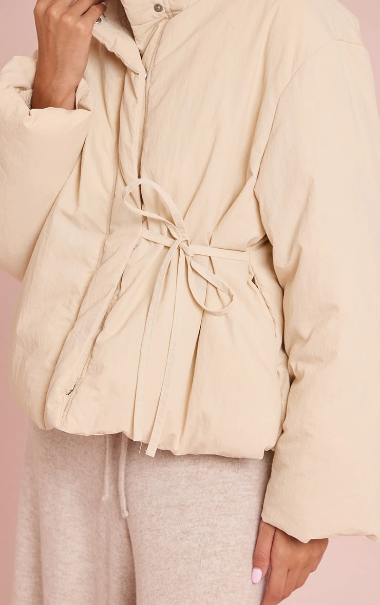 Prettylittlething Cream High Neck Tie Waist Quilted Puffer Jacket 4 Prettylittlething Cream High Neck Tie Waist Quilted Puffer Jacket - Image 4