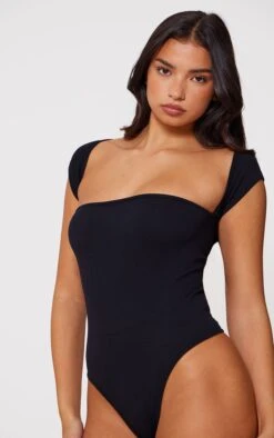 Prettylittlething Black Snatched Rib Cut Out Short Sleeve Bodysuit -Pretty Little Thing Shop e9f34852d751e309dde0a2e4a9e70738061bf36d cmw0108 4