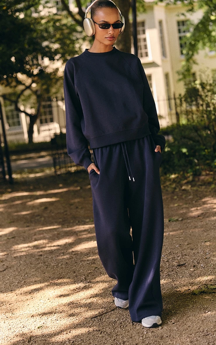 Prettylittlething Navy Embroidered Interlock Wide Leg Sweatpant 1 Prettylittlething Navy Embroidered Interlock Wide Leg Sweatpant