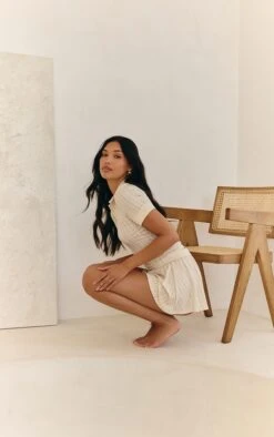 Prettylittlething Cream Textured Button Detail Mini Skort -Pretty Little Thing Shop f32e2a3c5c2a451dfc79e1382d1f8502e49972cc CNM6173 5 cream textured button detail mini skort