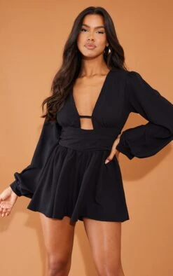 Prettylittlething Black Textured Plunge Long Sleeve Tie Back Romper