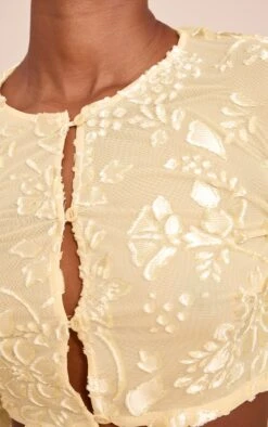 Prettylittlething Butter Yellow Floral Sheer Button Cropped Top -Pretty Little Thing Shop fe90f808d12929987c77bba256496a0608e5a437 CNN7086 4 butter yellow floral sheer button cropped top